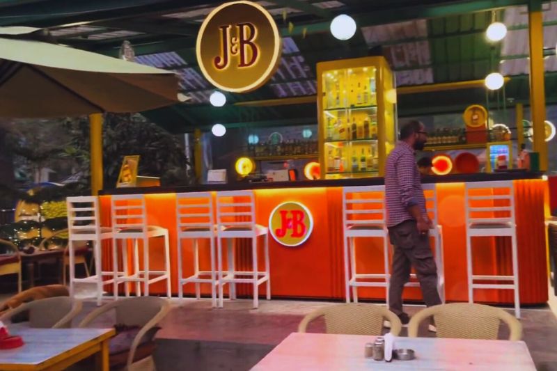 "Cozy riverside café in Kasol serving Israeli cuisine with mountain views, perfect for backpackers and digital nomads"