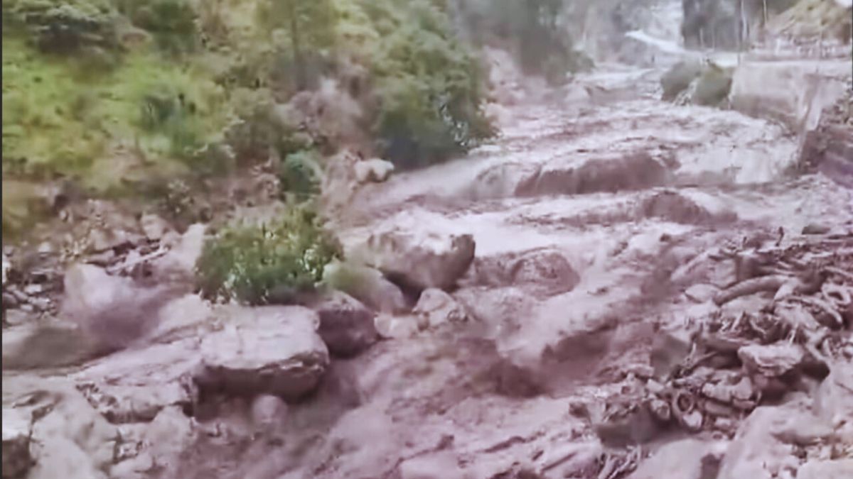 Damaged road and overflowing river in Kullu after heavy monsoon rains