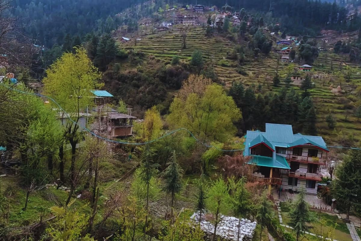 Aerial view of Tandi village at the confluence of Chandra and Bhaga rivers with mountain backdrop in Himachal Pradesh