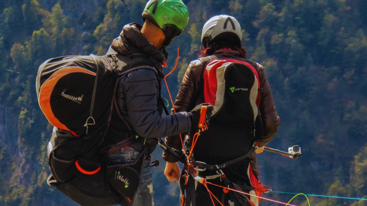  Helmet, harness, and parachute setup before a tandem flight in Bir Billing