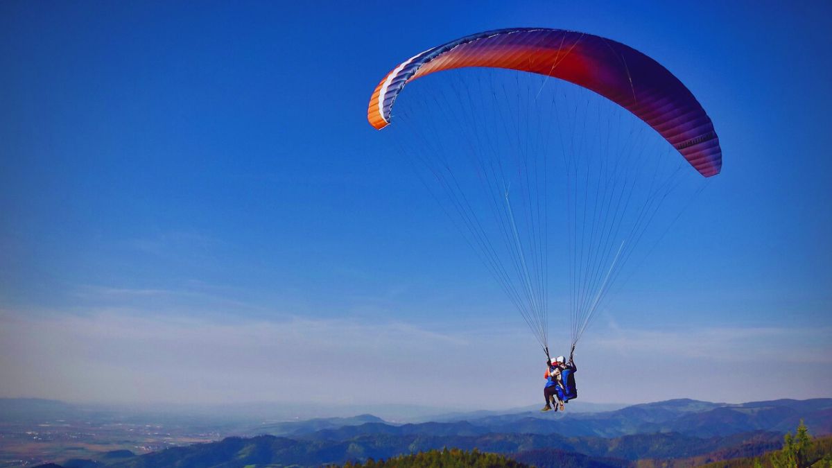 Green meadows and blue skies in Bir Billing during peak paragliding season