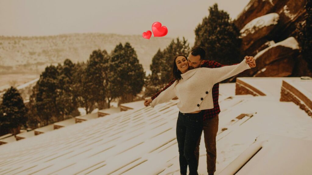 Couple enjoying a mountain view during their honeymoon in Himachal