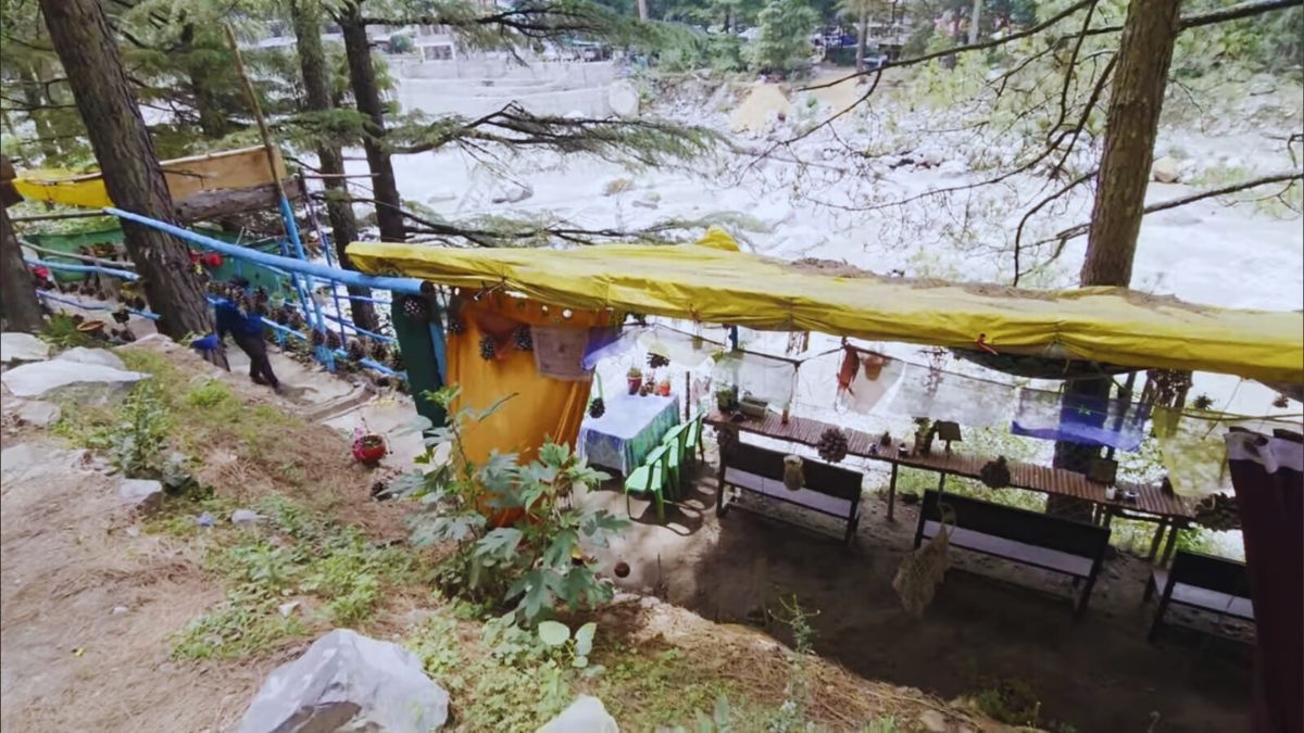 Backpackers at riverside cafés and camps in Kasol, Himachal Pradesh