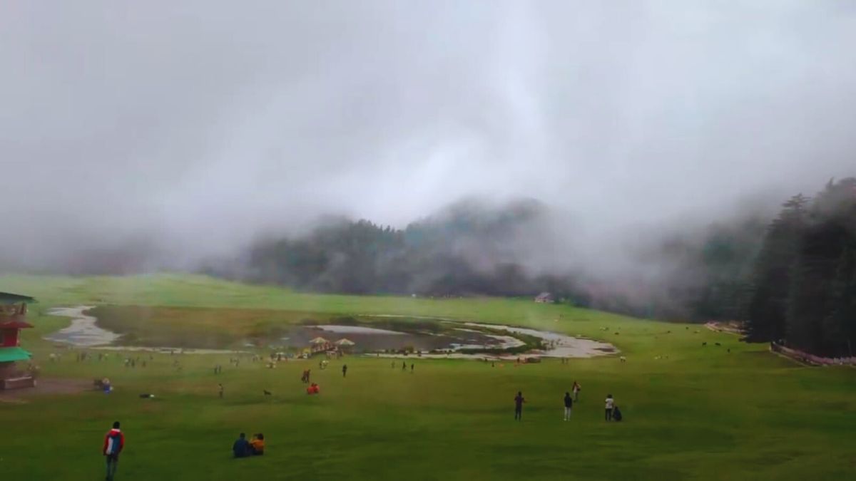 “Zero‑visibility fog covering Khajjiar meadow during monsoon”