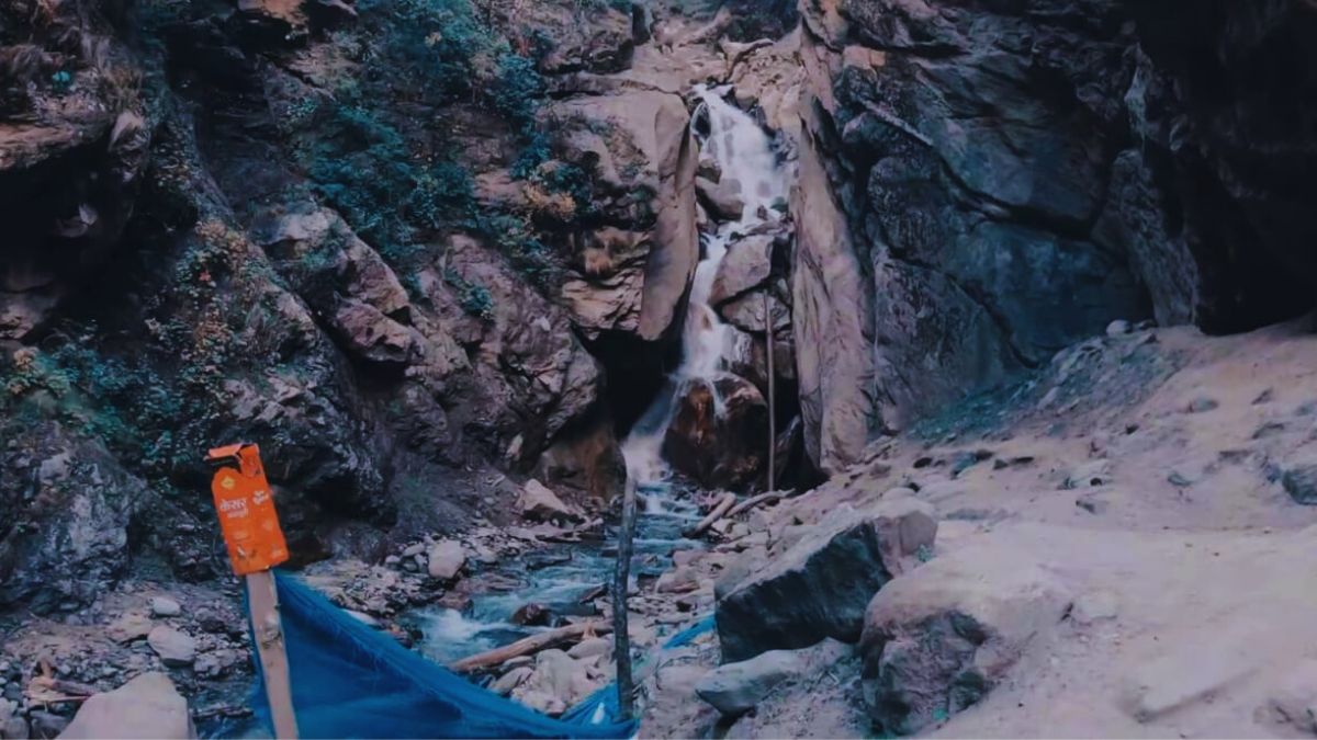 Camping tents near hot springs at sunrise in Kheerganga, Himachal Pradesh