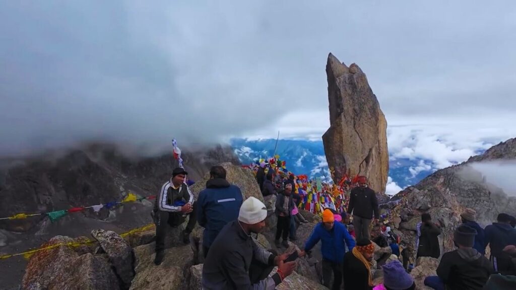 Pilgrims at Kinnaur Kailash Shivling peak with Himalayan backdrop during Yatra 2025