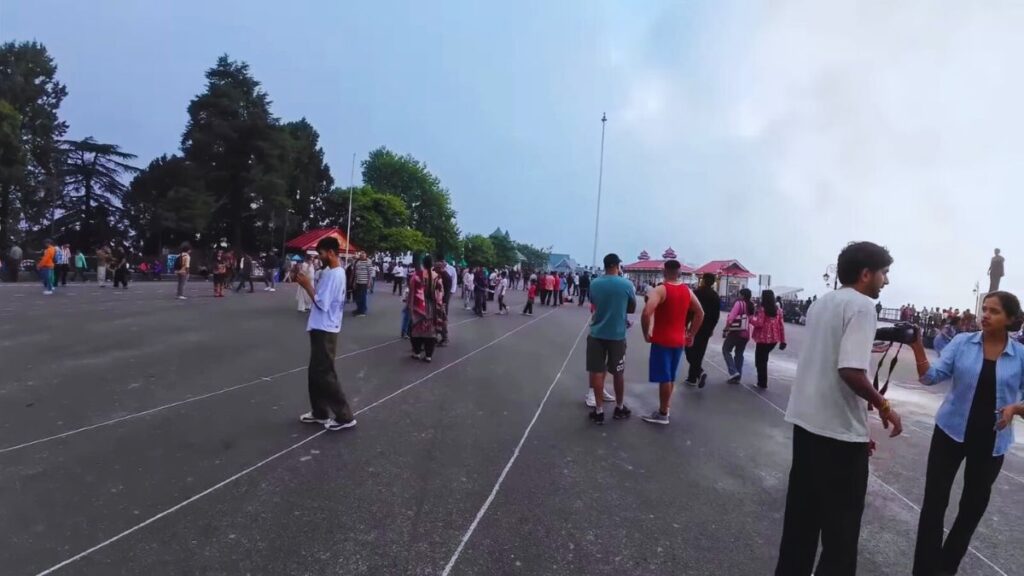 Tourists enjoying Shimla Ridge peacefully under cloudy but calm skies in July 2025 after monsoon slowdown