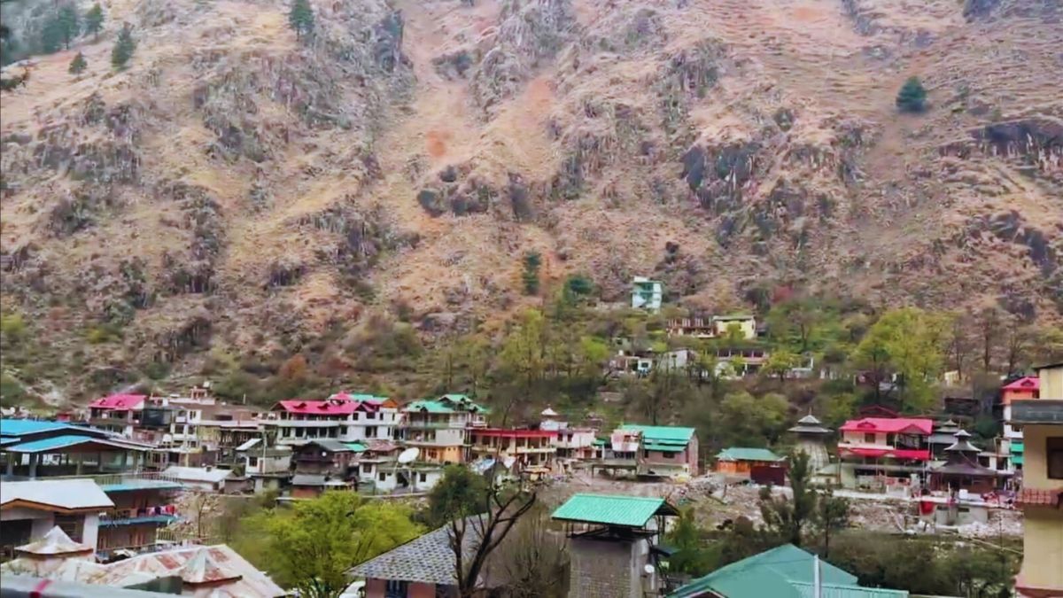 Snow-dusted village of Tosh with panoramic Himalayan view